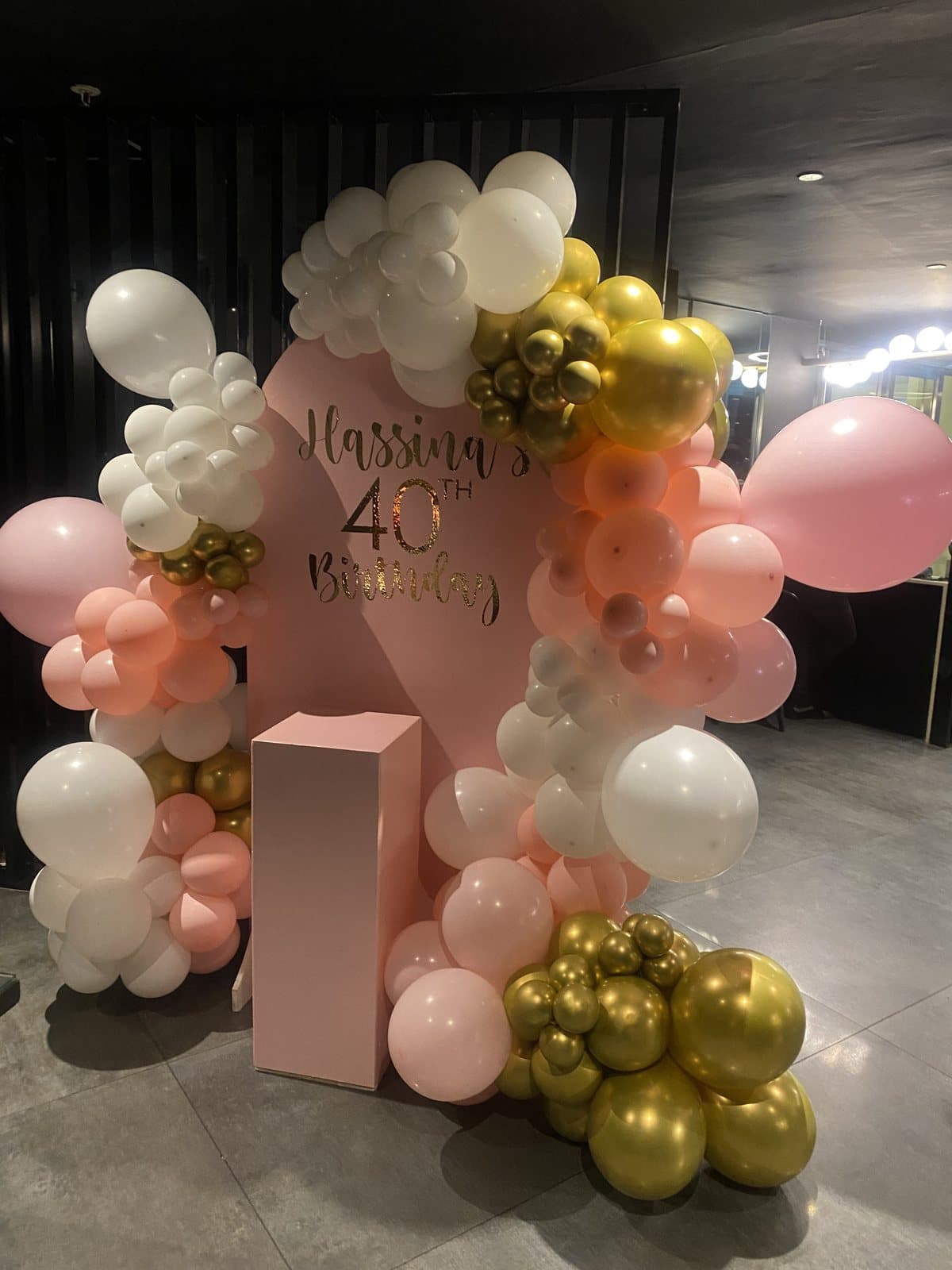 Gold, white and blush balloon arch for a fortieth birthday celebration