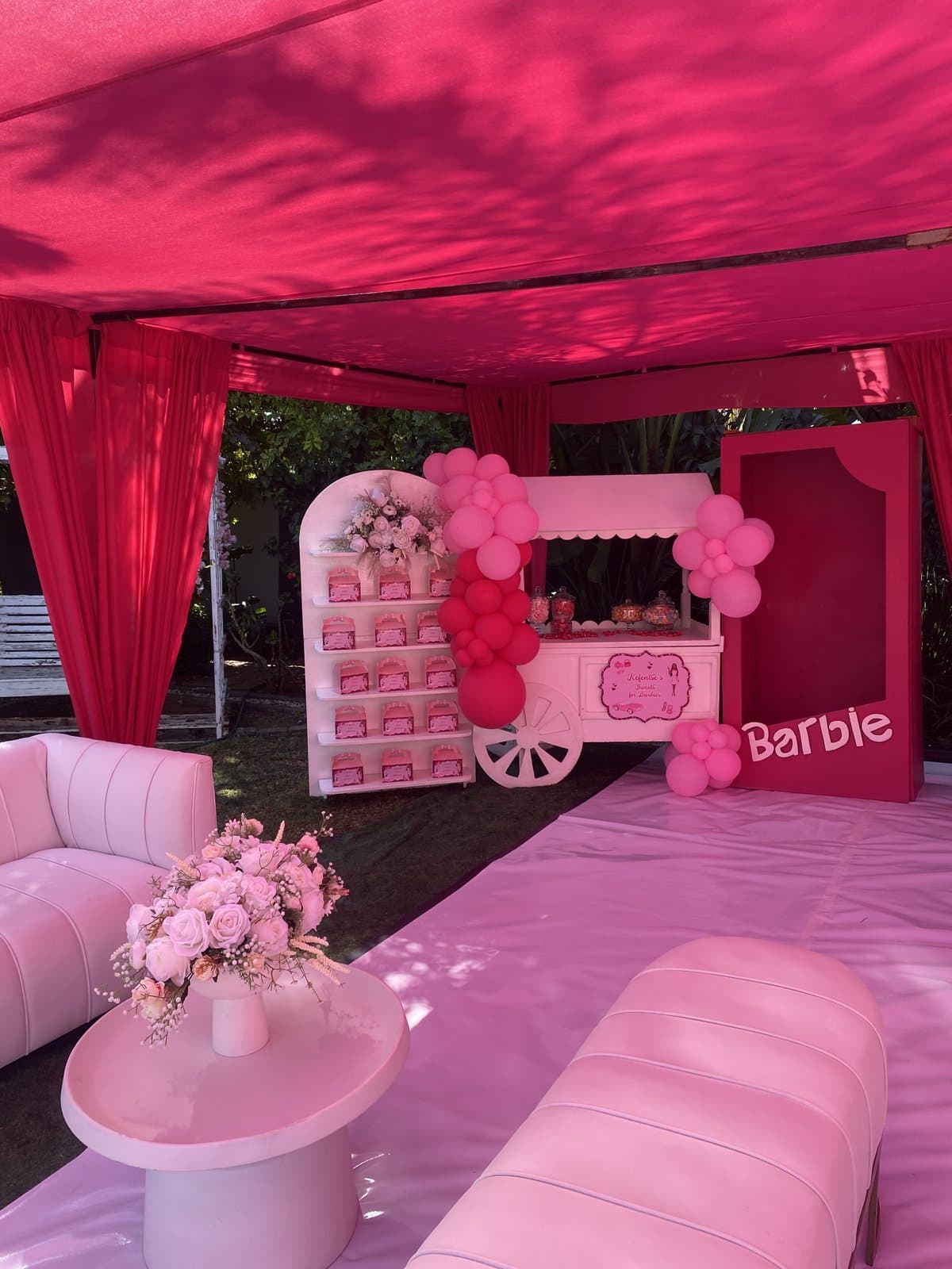 Hot pink cabana lounge with a Barbie-styled dessert cart