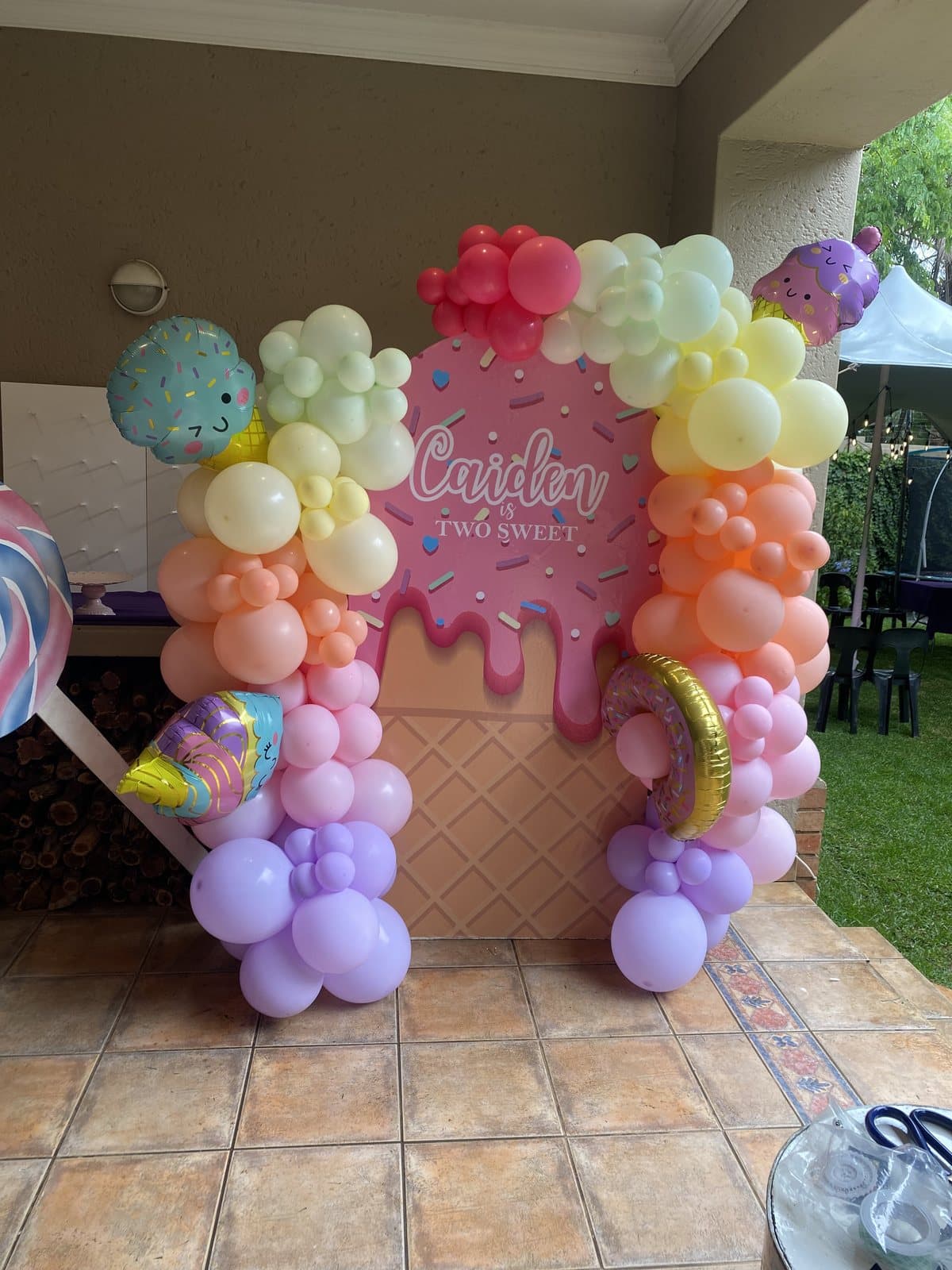 Pastel rainbow ice-cream shaped balloon sculpture for a birthday party